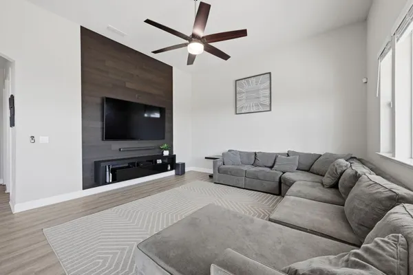 a living room with furniture and a large window