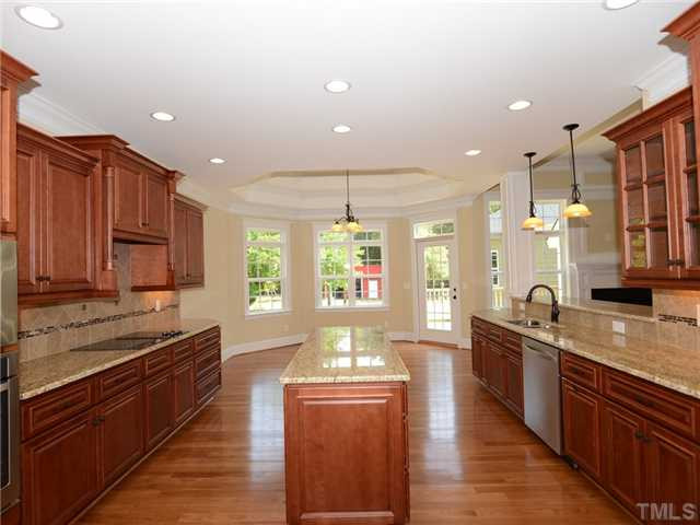 651 Friendship Church Road Middlesex, NC 27557 - Photo 9 of 25 View from Kitchen into Breakfast Nook and Deck off Rear of Home. Enjoy your coffee while watching your animals at the barn & in the pasture. Kitchen