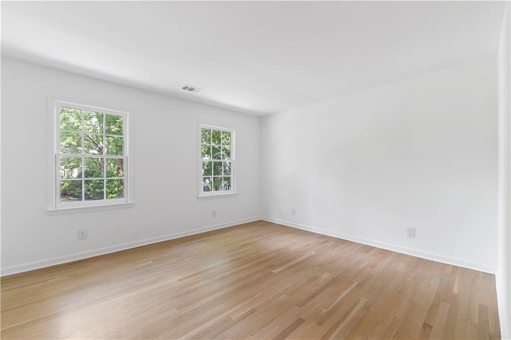 8965 Laurel Way Alpharetta, GA 30022 - Photo 36 of 79 an empty room with wooden floor and windows