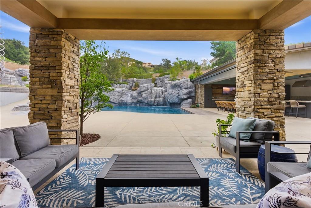 29131 Bouquet Canyon Road Silverado, CA 92676 - Photo 19 of 74 Covered outdoor patio overlooking resort pool and backyard