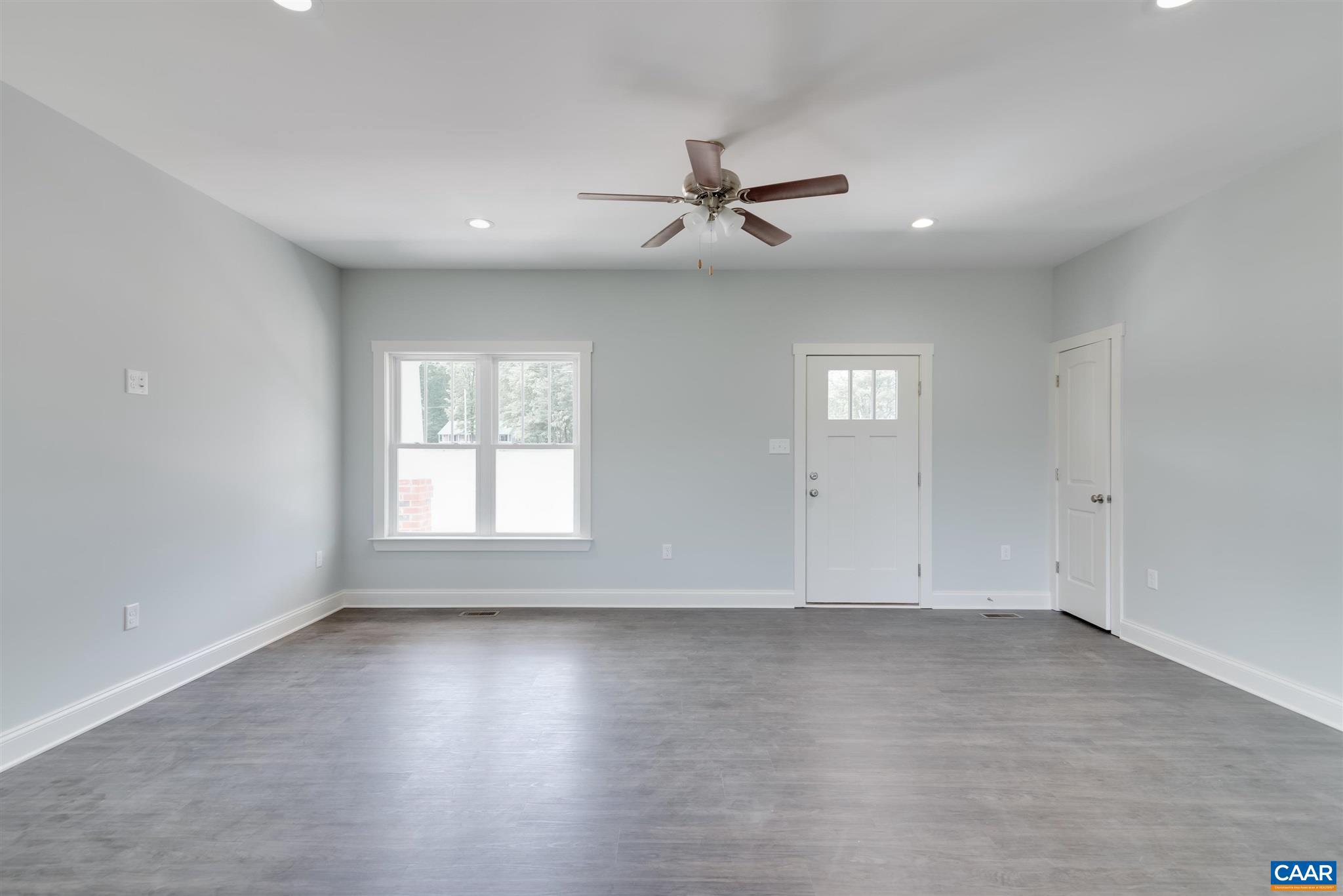 6008 Old Columbia Road Columbia, VA 23038 - Photo 3 of 23 an empty room with wooden floor and windows