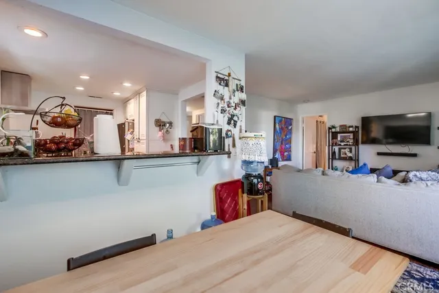 a bedroom with bed and flat screen tv
