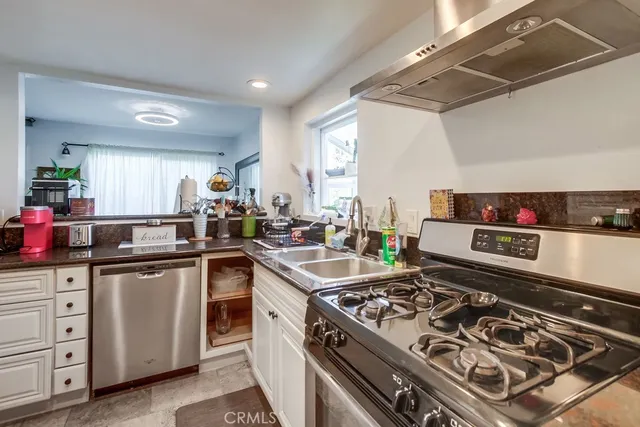 a kitchen with a stove and a sink