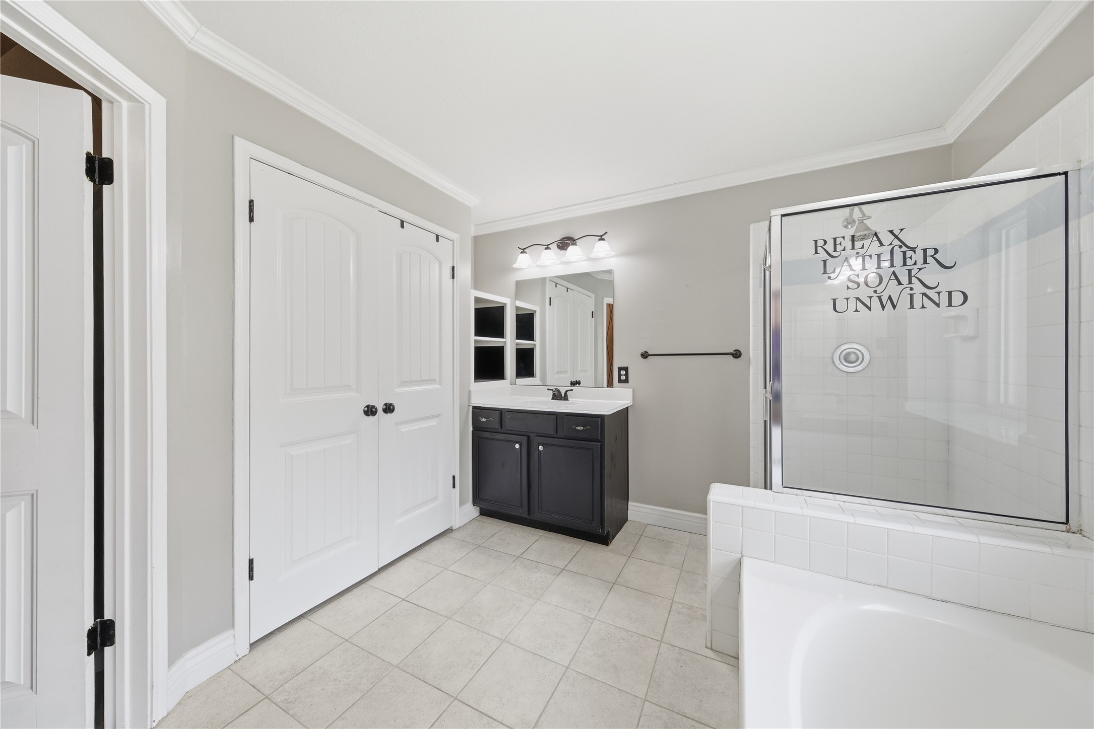 13506 Spring Court Tomball, TX 77375 - Photo 19 of 37 a large white kitchen with a sink and refrigerator