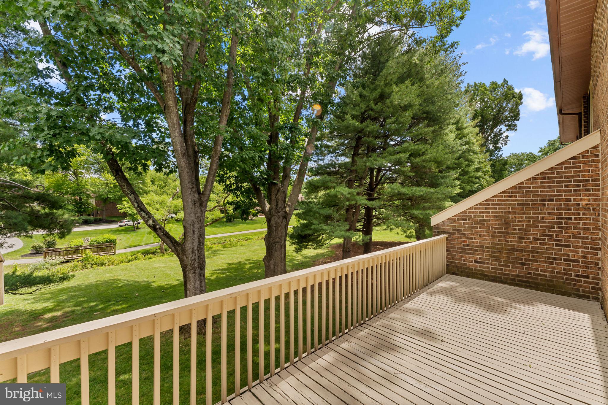 14 Elan Lane Chesterbrook, PA 19087 - Photo 29 of 31 Serene balcony with lush greenery views.