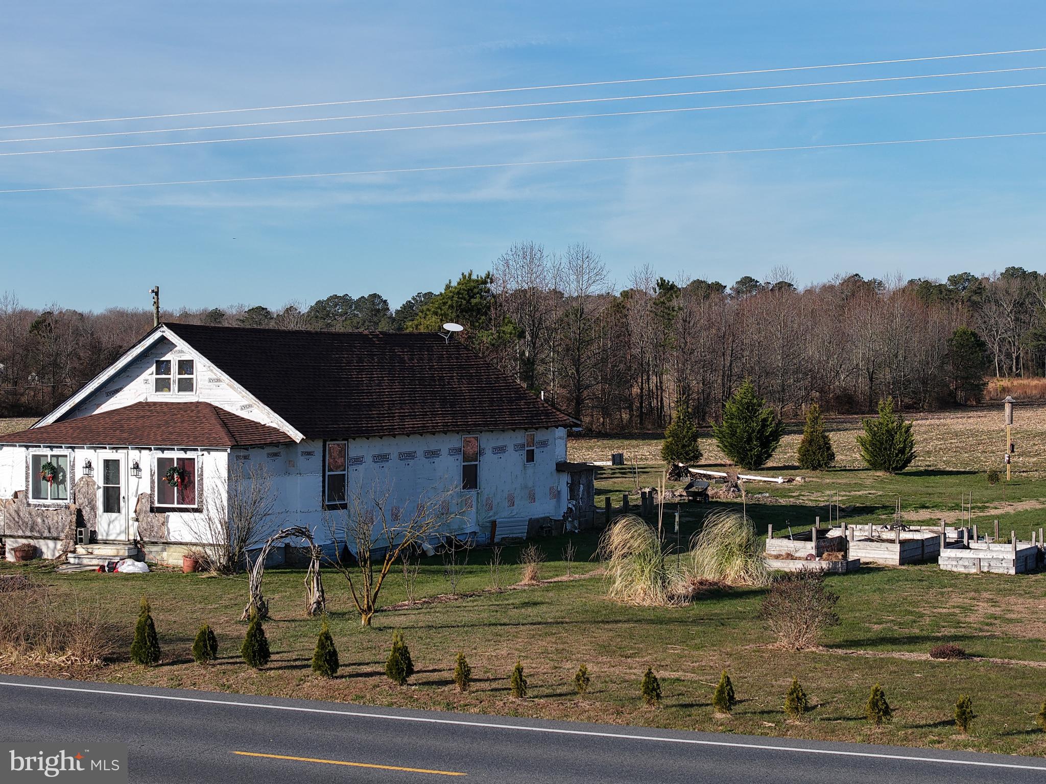 8304-8344 Gumboro Road Pittsville, MD 21850 - Photo 2 of 7 a backyard of a house