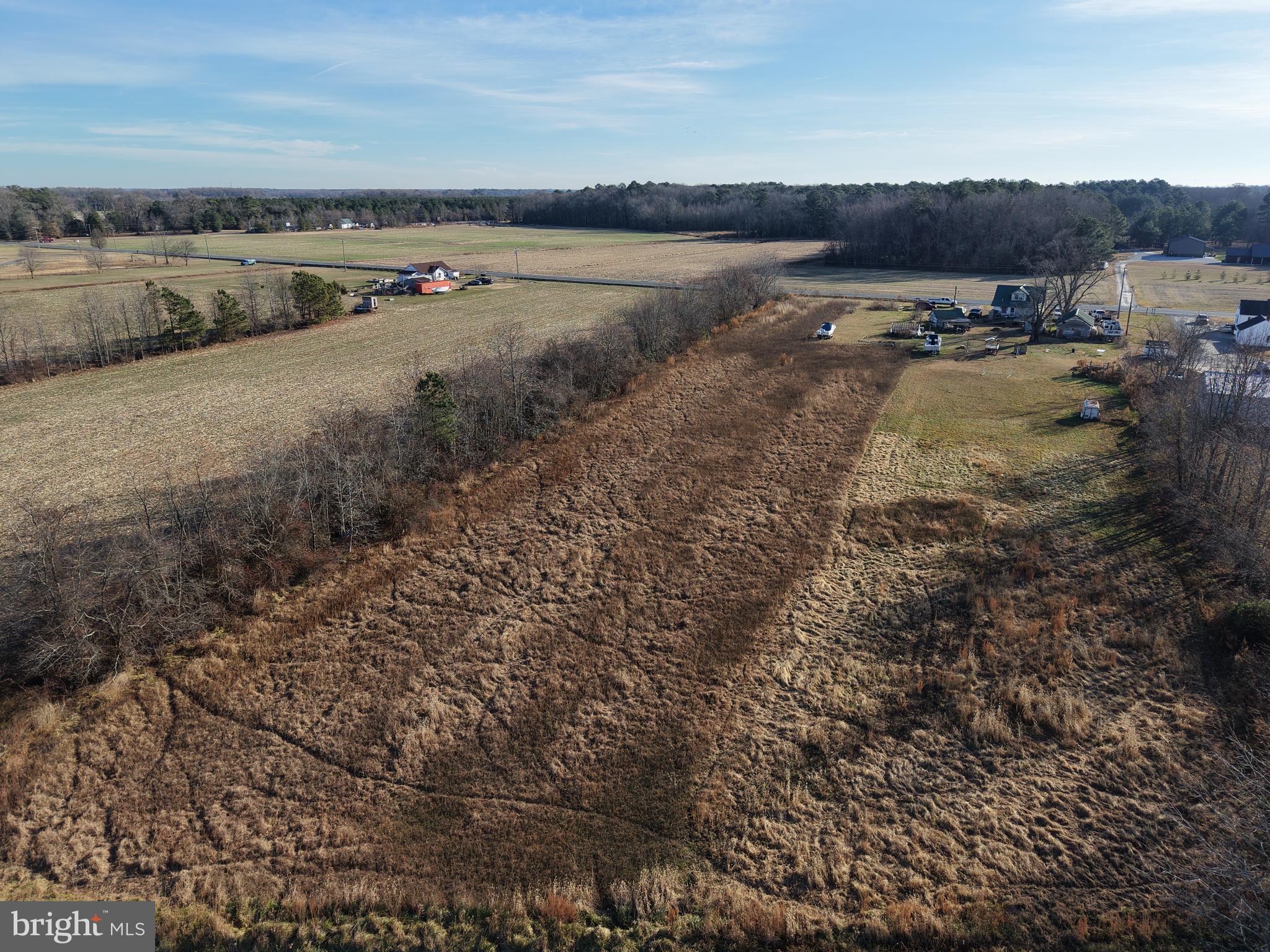 8304-8344 Gumboro Road Pittsville, MD 21850 - Photo 5 of 7 a view of a lake with houses
