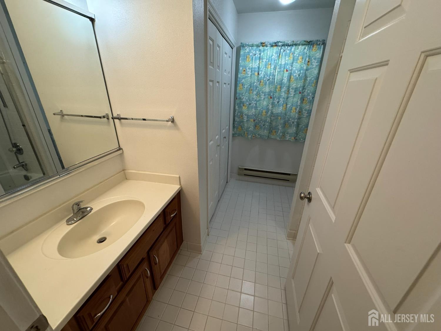 723 Mt Vernon Road, Unit A Monroe Township, NJ 08831 - Photo 12 of 19 a bathroom with a double vanity sink a toilet and a shower