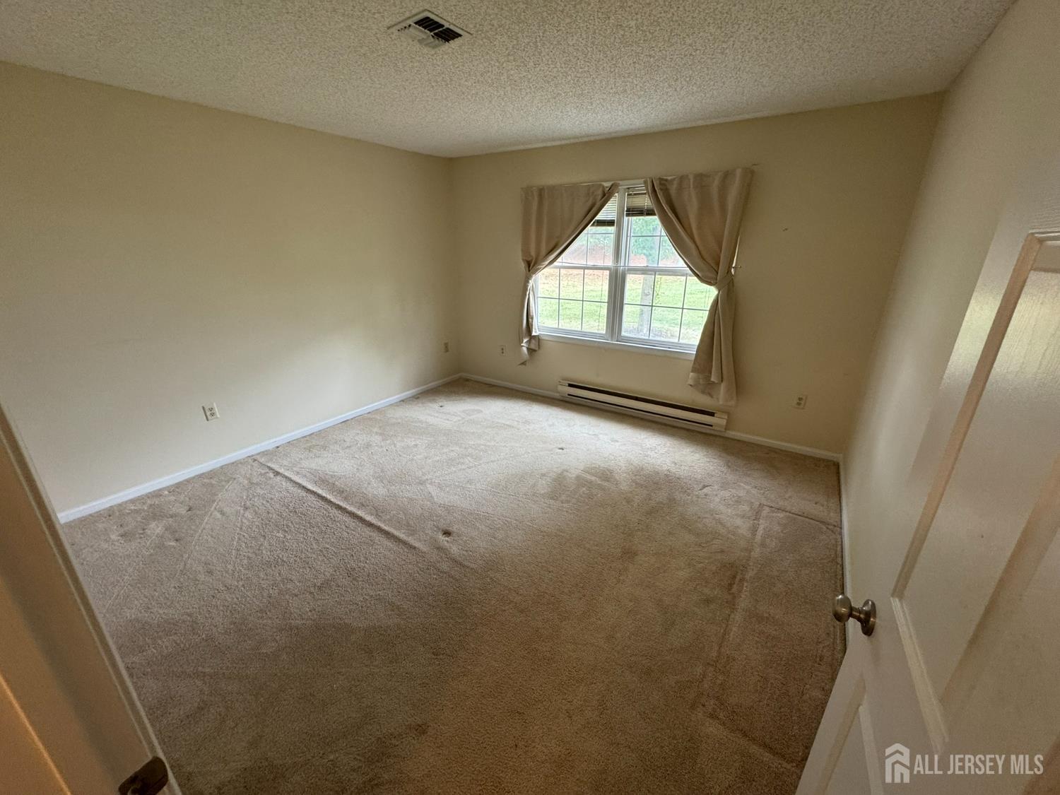 723 Mt Vernon Road, Unit A Monroe Township, NJ 08831 - Photo 16 of 19 an empty room with windows