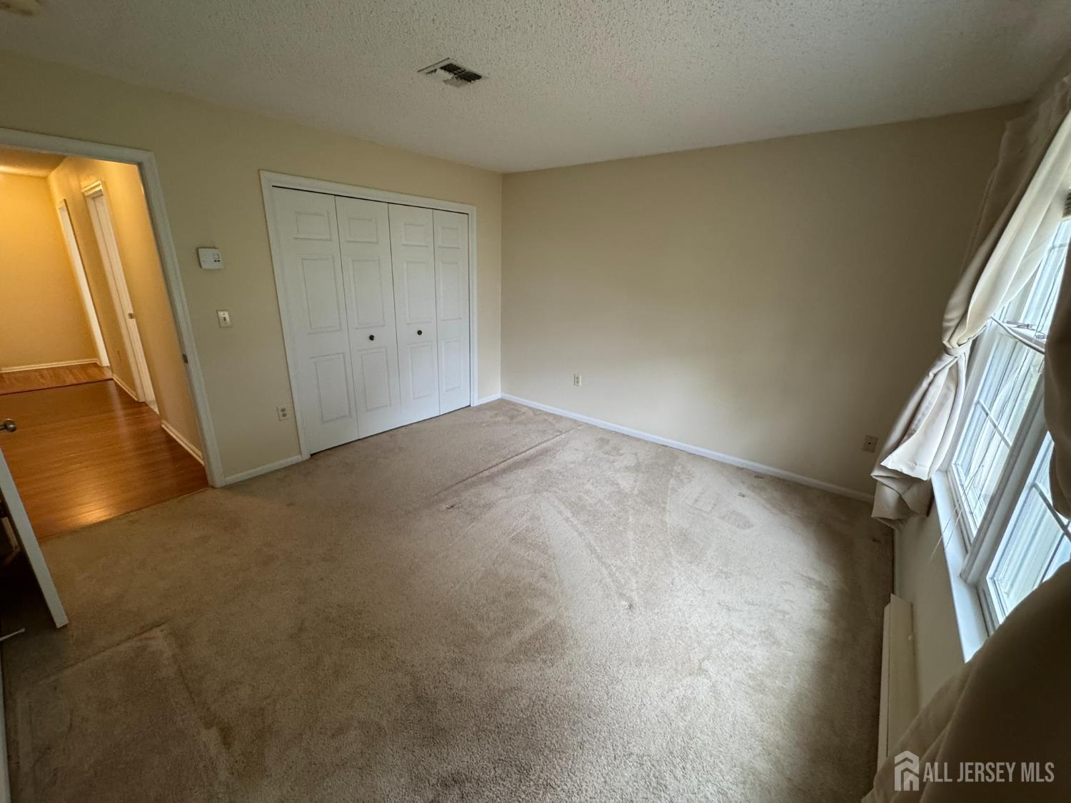 723 Mt Vernon Road, Unit A Monroe Township, NJ 08831 - Photo 17 of 19 an empty room with windows