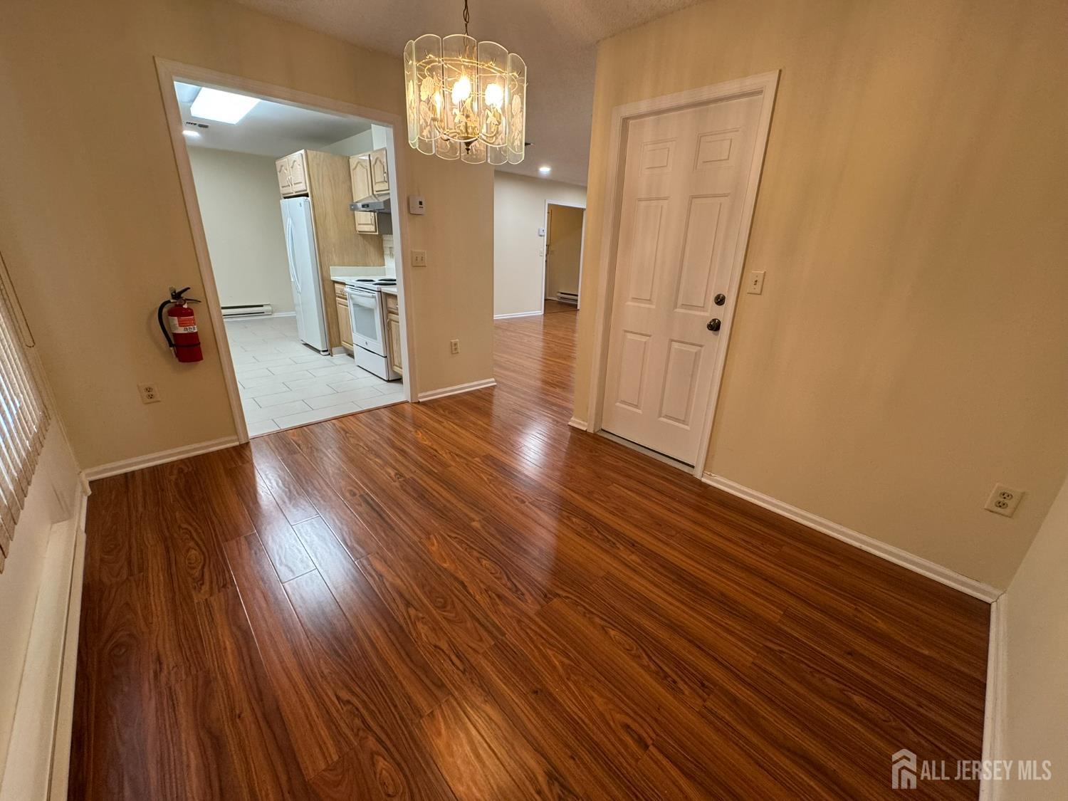 723 Mt Vernon Road, Unit A Monroe Township, NJ 08831 - Photo 5 of 19 wooden floor in an empty room with a window