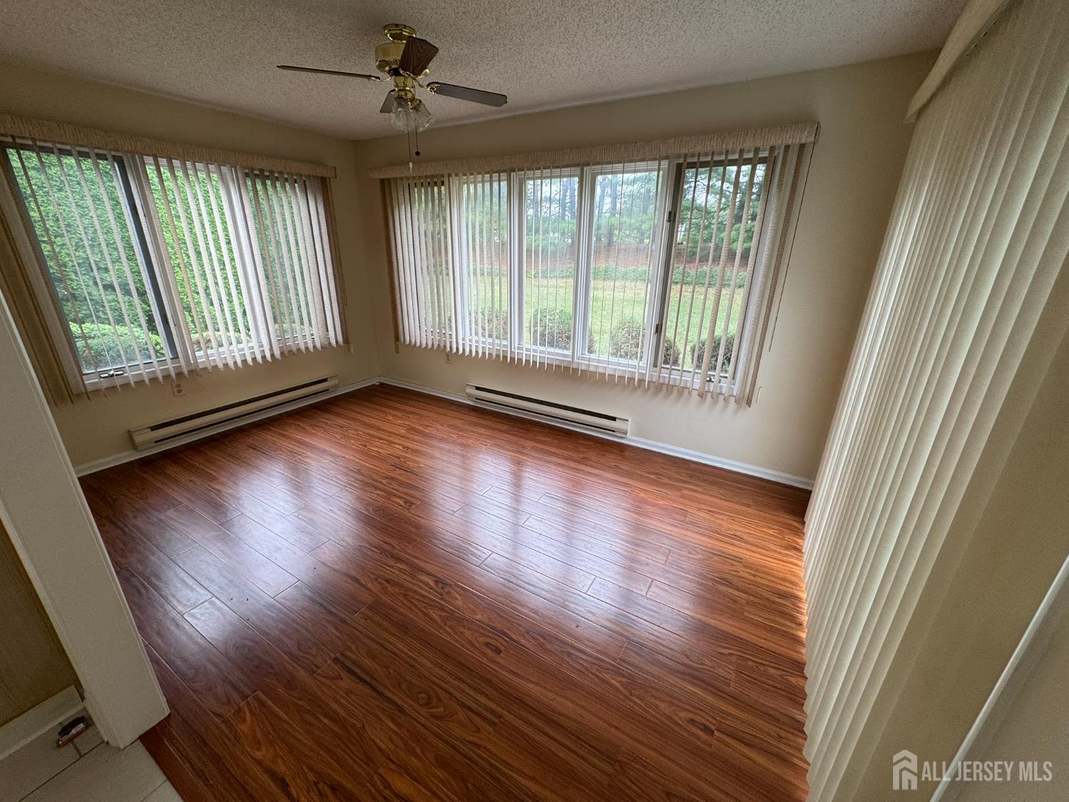 723 Mt Vernon Road, Unit A Monroe Township, NJ 08831 - Photo 8 of 19 wooden floor in an empty room with a window