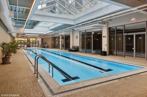 a view of swimming pool with seating area