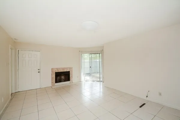 a view of a kitchen with a sink refrigerator and cabinets