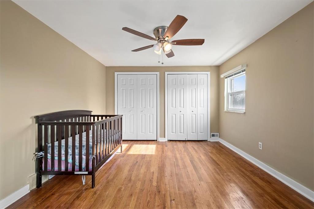 504 Nichols Road Pittsburgh, PA 15237 - Photo 17 of 25 a view of a livingroom with wooden floor a ceiling fan and windows