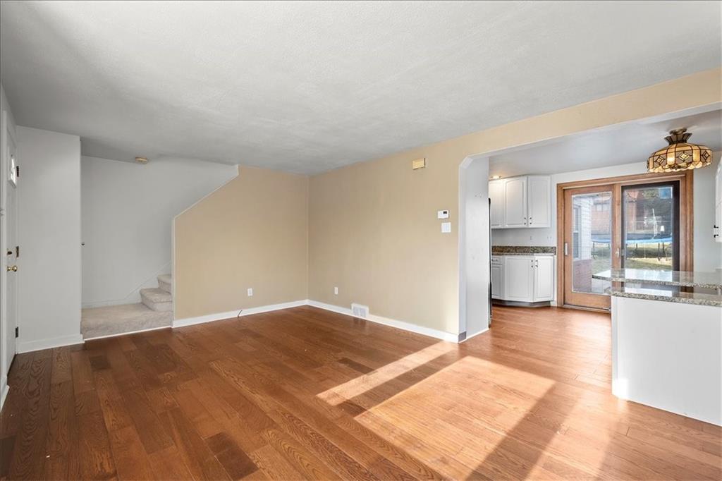 504 Nichols Road Pittsburgh, PA 15237 - Photo 5 of 25 a view of a big room with wooden floor and windows