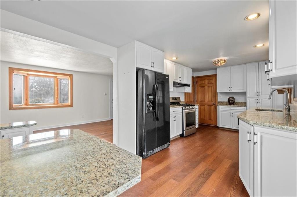 504 Nichols Road Pittsburgh, PA 15237 - Photo 8 of 25 a kitchen with stainless steel appliances granite countertop a refrigerator a stove and a sink
