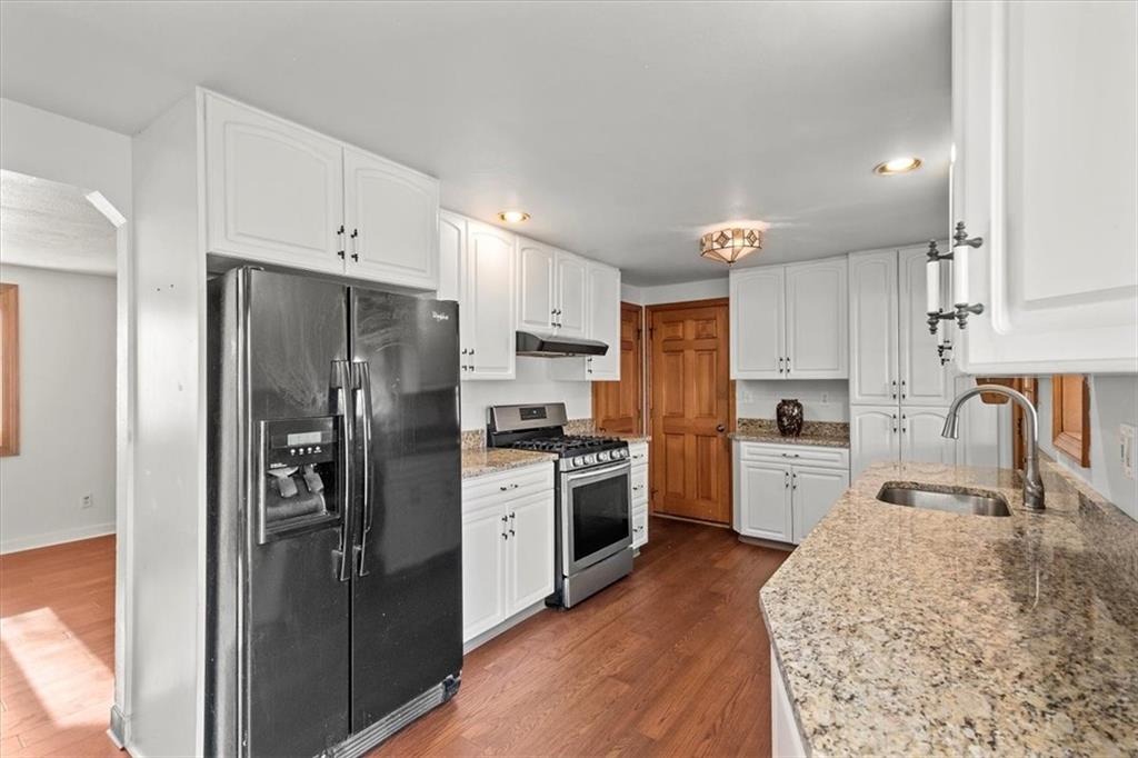 504 Nichols Road Pittsburgh, PA 15237 - Photo 9 of 25 a kitchen with stainless steel appliances granite countertop a refrigerator sink and stove