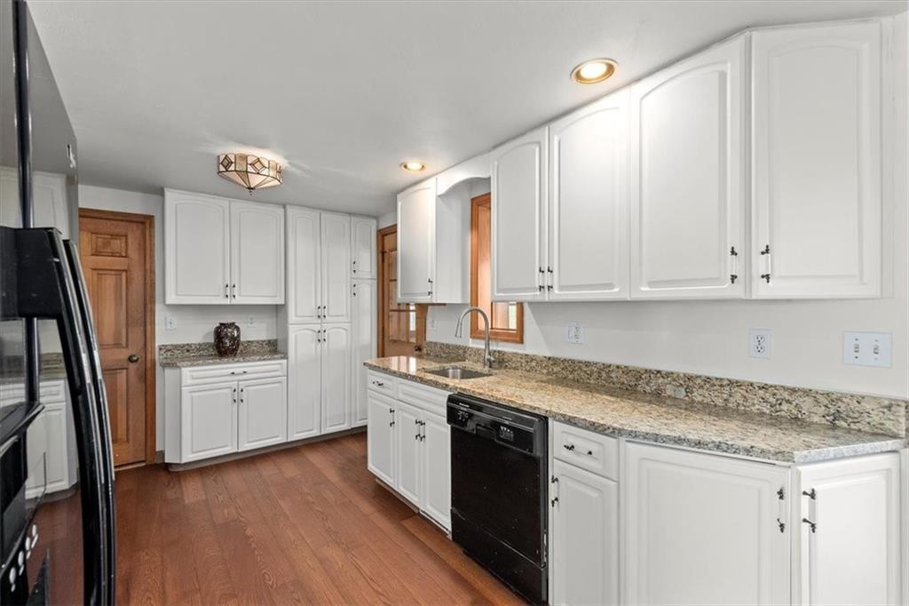 504 Nichols Road Pittsburgh, PA 15237 - Photo 10 of 25 a kitchen with granite countertop white cabinets and white appliances