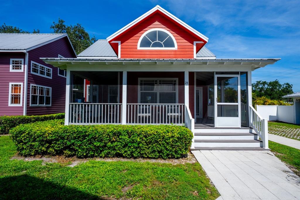 a view of a house with porch and wooden floor