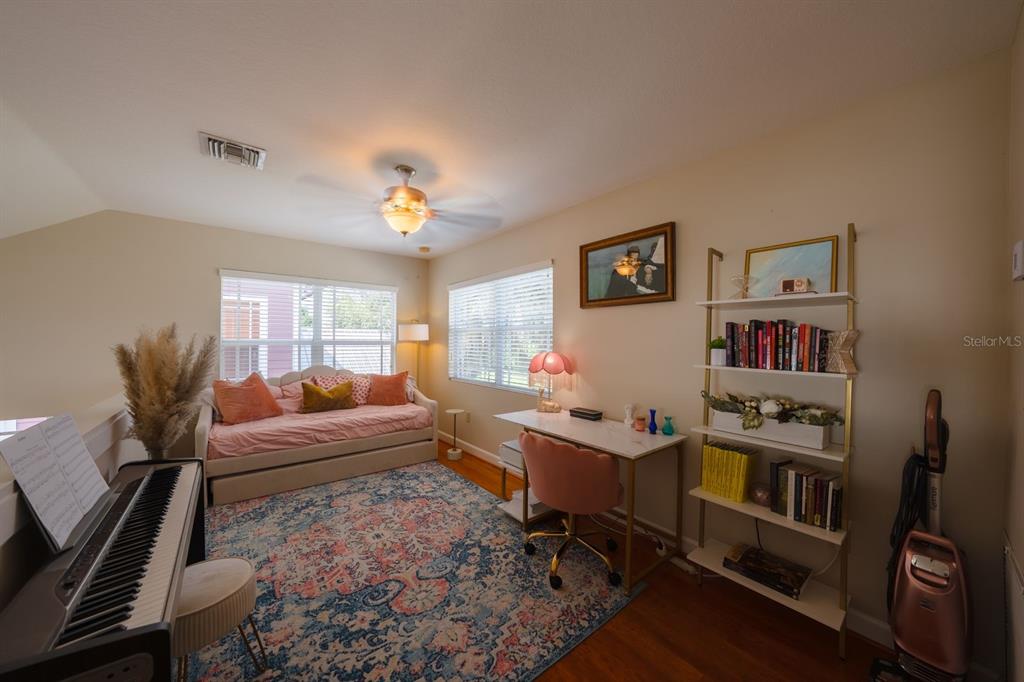 4334 Highway 441, Unit 24 Okeechobee, FL 34974 - Photo 12 of 40 a living room with furniture a rug and a bookshelf