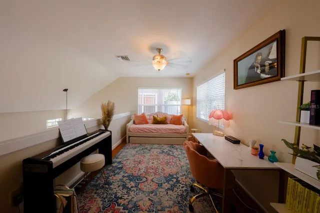 a bed room with furniture and a window