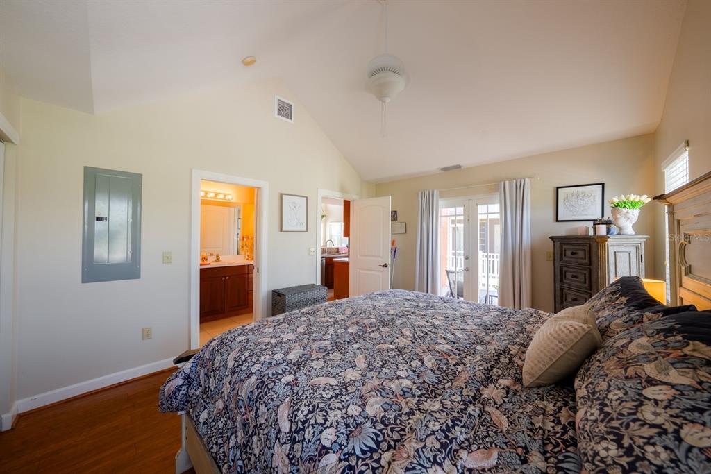 4334 Highway 441, Unit 24 Okeechobee, FL 34974 - Photo 25 of 40 a bedroom with a bed and dresser with mirror