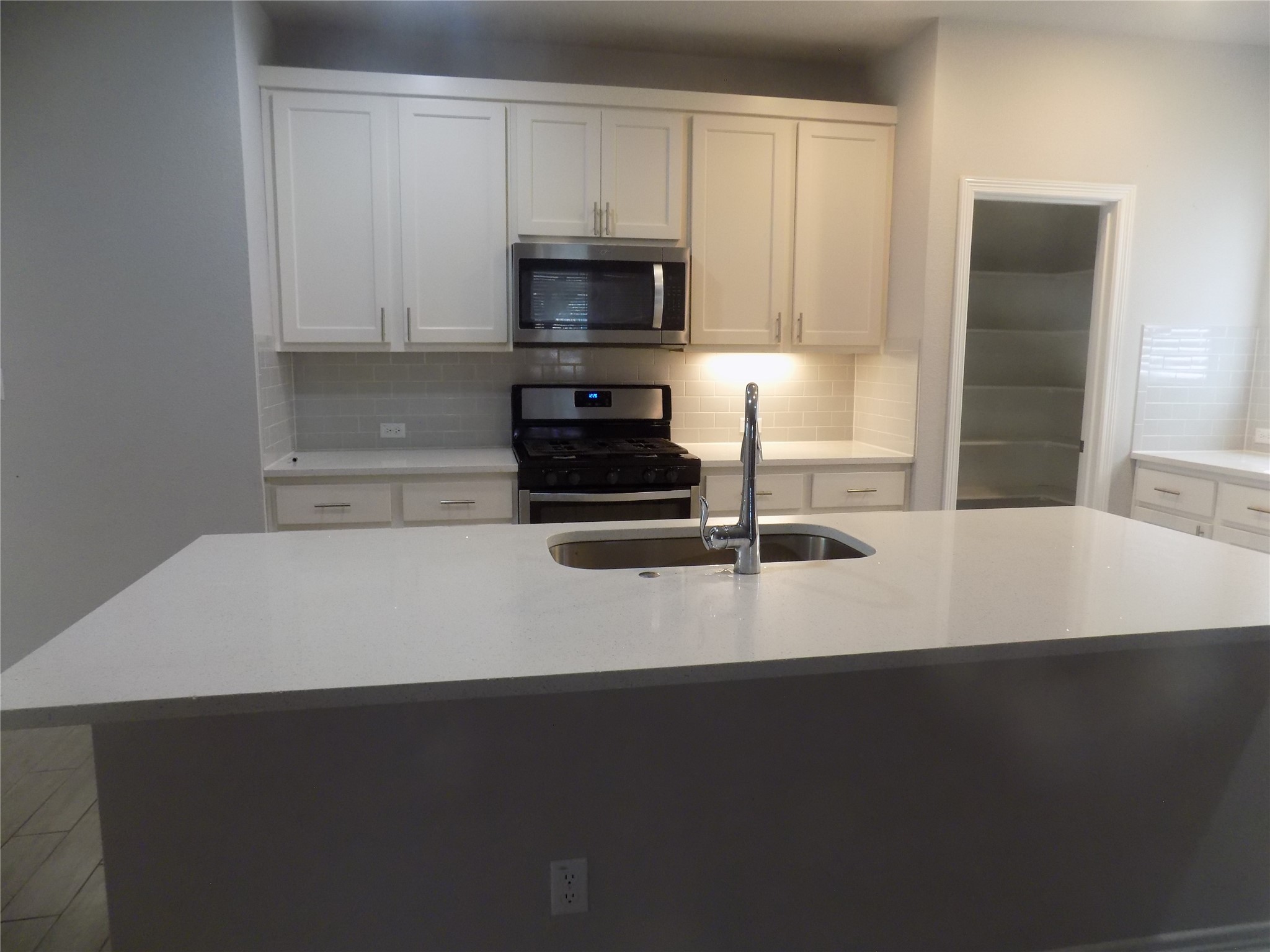 1133 Capra Lane Leander, TX 78641 - Photo 11 of 25 This kitchen features a bright ambiance, showcasing contemporary design and practical functionality for everyday living.