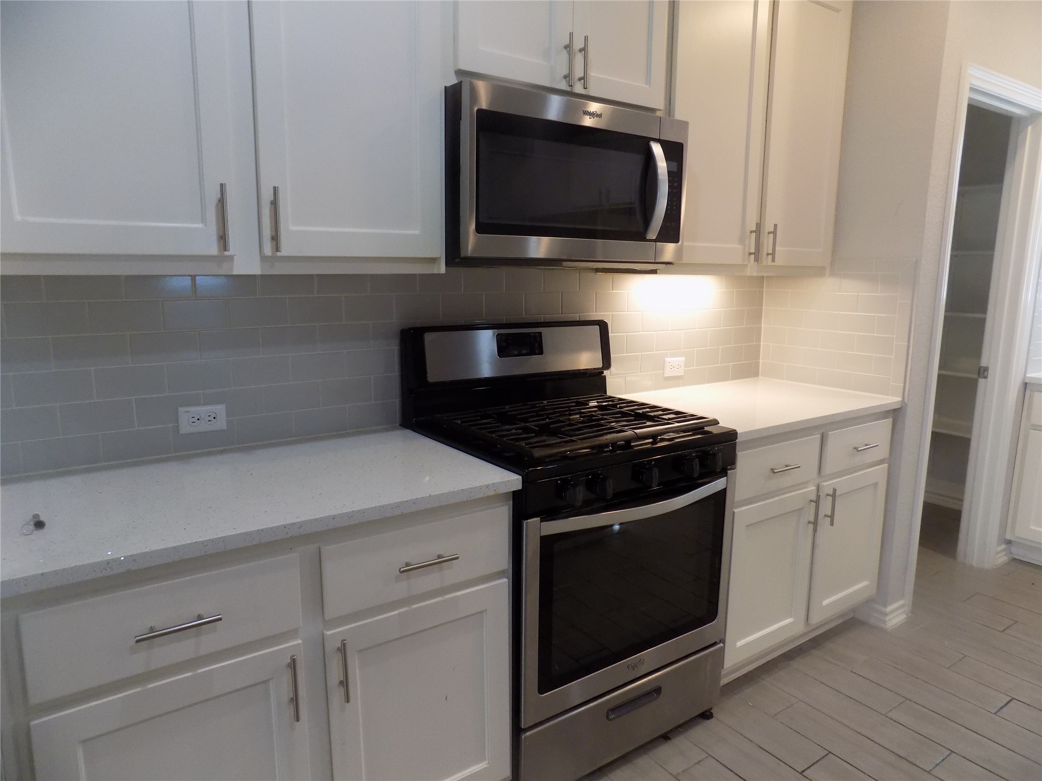 1133 Capra Lane Leander, TX 78641 - Photo 12 of 25 This modern kitchen features crisp cabinetry and sleek appliances, perfect for culinary endeavors.