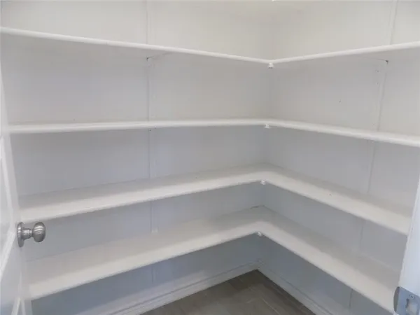 a view of an empty walk in closet