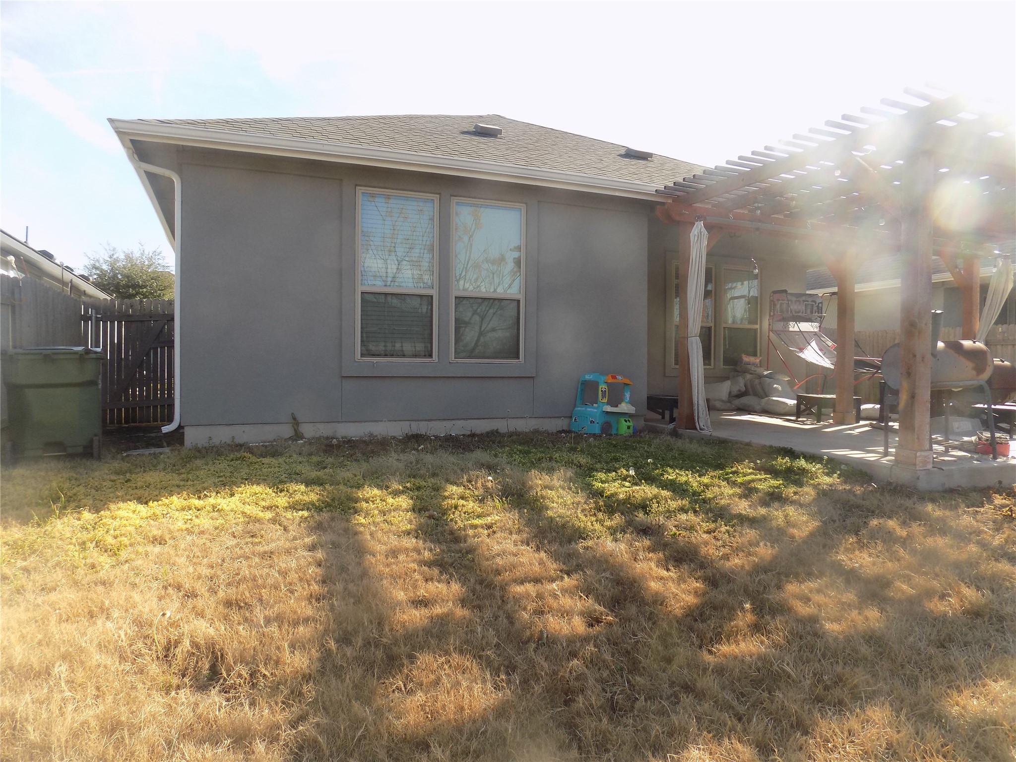 1133 Capra Lane Leander, TX 78641 - Photo 25 of 25 This residence features a patio with an open pergola, perfect for outdoor leisure.