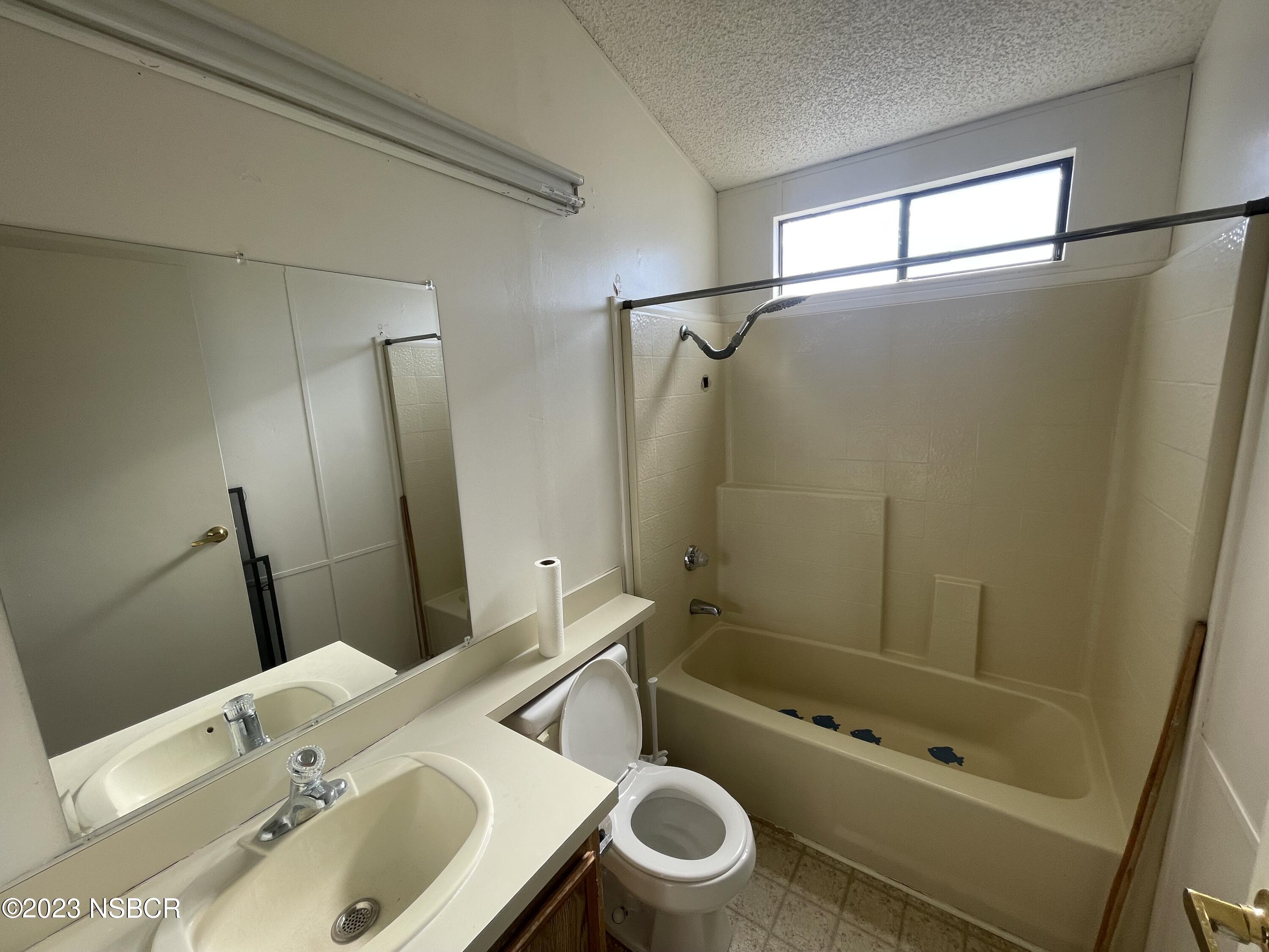 1317 V Street, Unit 114 Lompoc, CA 93436 - Photo 13 of 24 a bathroom with a sink toilet and shower
