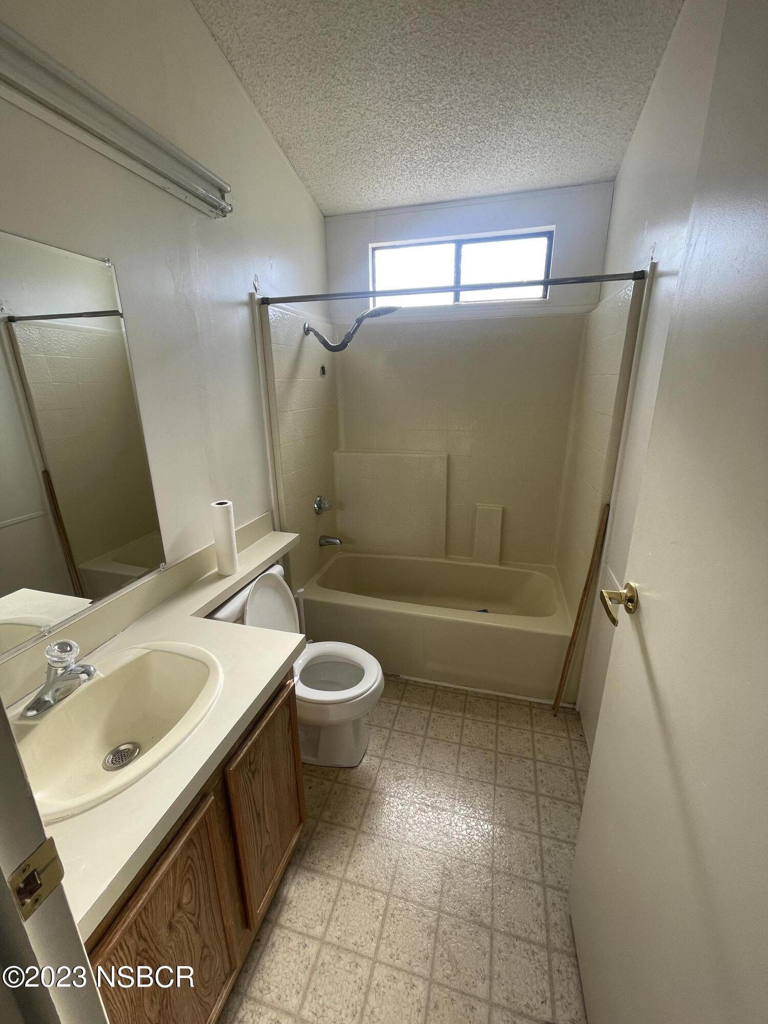 1317 V Street, Unit 114 Lompoc, CA 93436 - Photo 14 of 24 a bathroom with a sink toilet and shower