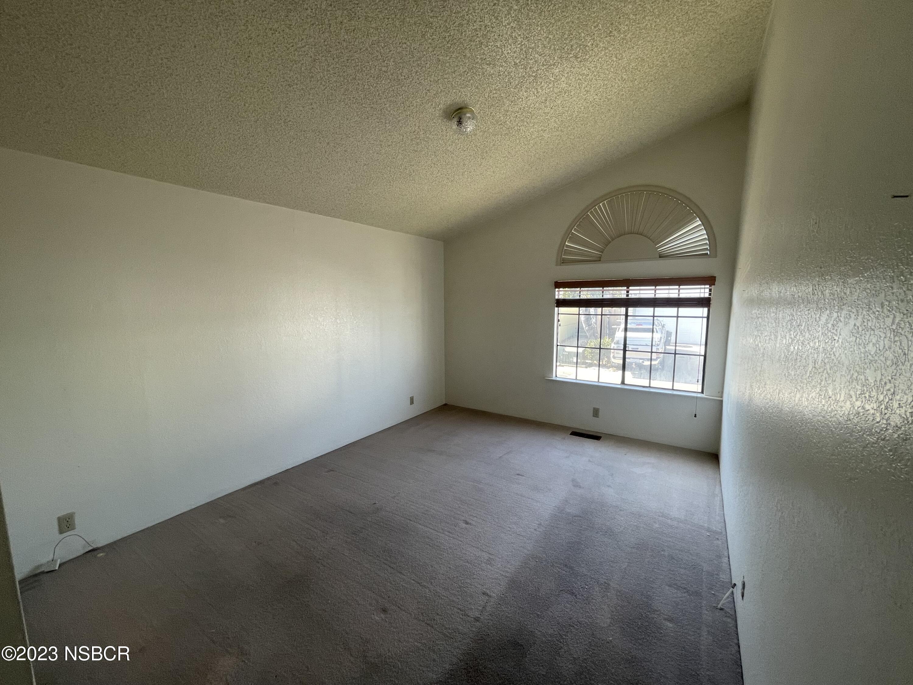 1317 V Street, Unit 114 Lompoc, CA 93436 - Photo 17 of 24 an empty room with windows