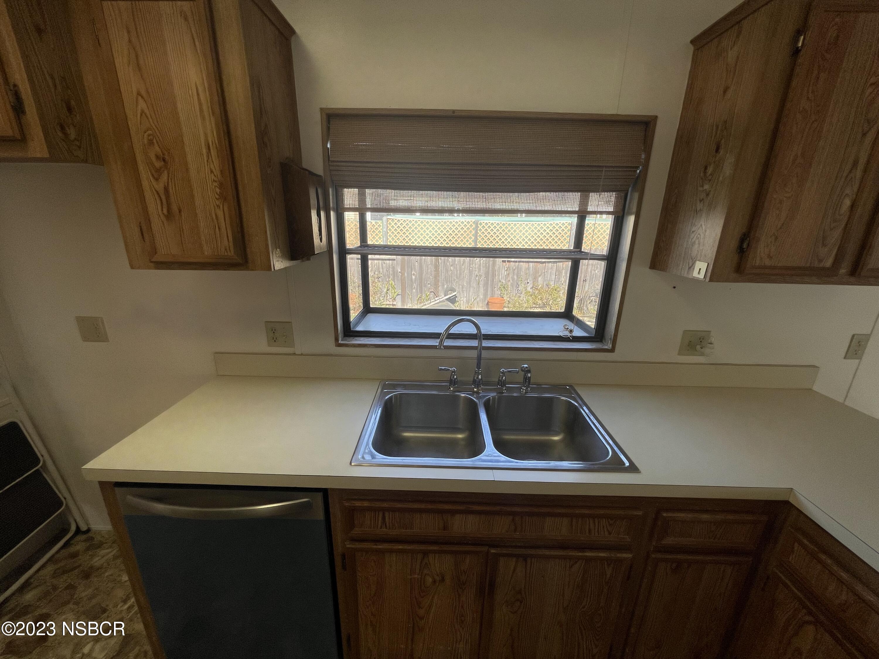 1317 V Street, Unit 114 Lompoc, CA 93436 - Photo 24 of 24 a view of kitchen sink window and cabinets