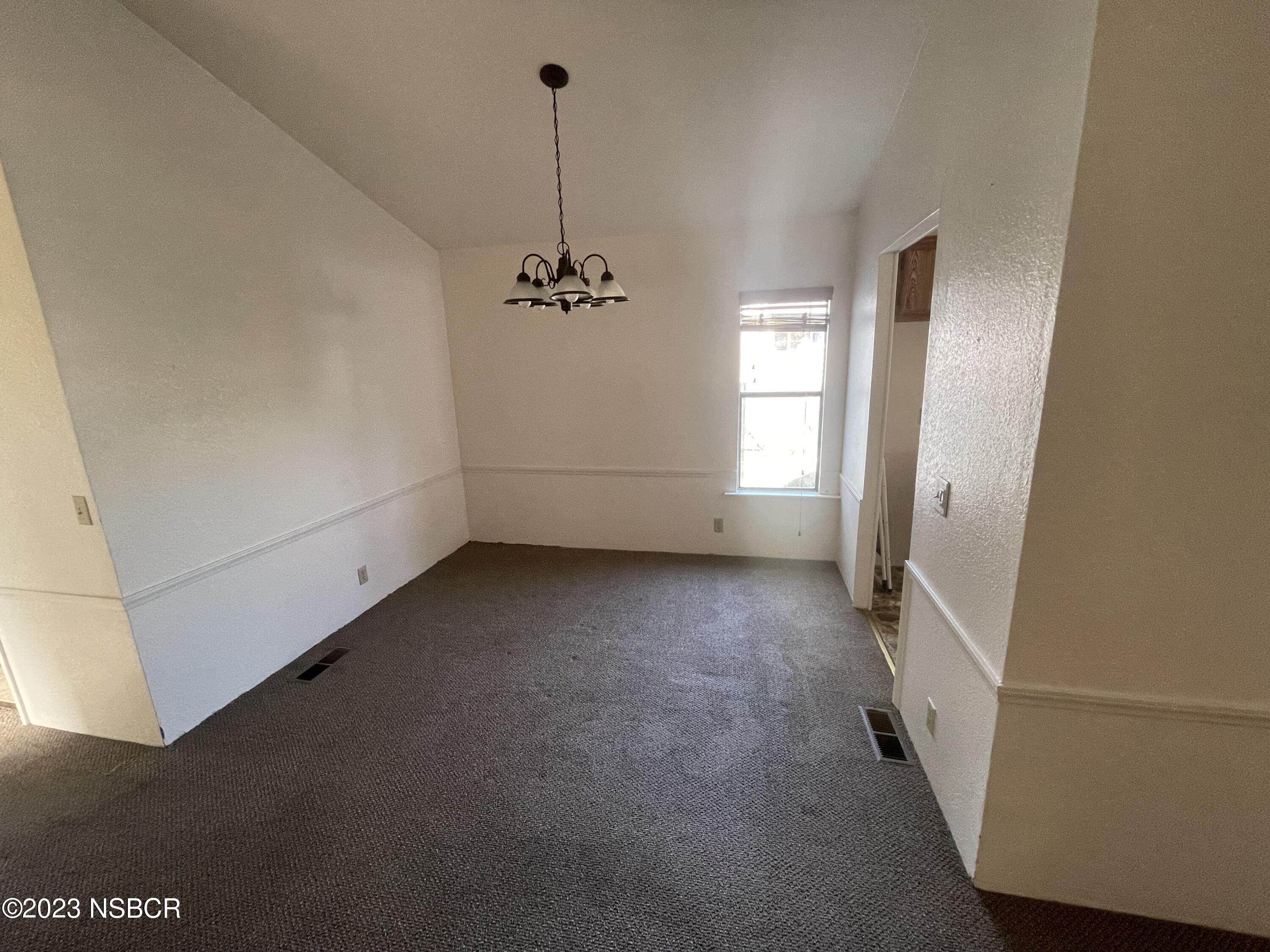 1317 V Street, Unit 114 Lompoc, CA 93436 - Photo 4 of 24 a view of empty room with windows