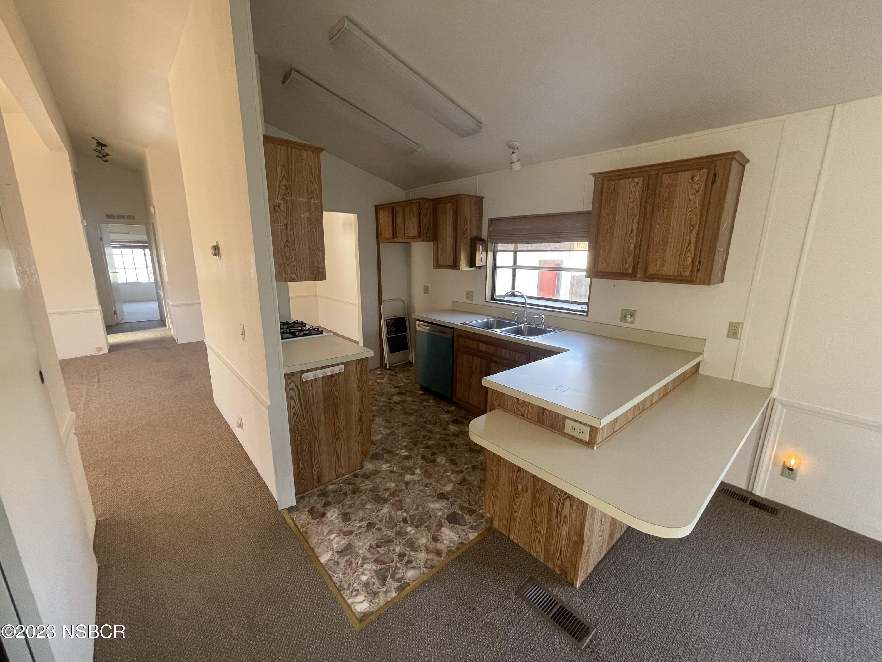 1317 V Street, Unit 114 Lompoc, CA 93436 - Photo 9 of 24 a room with furniture and a window