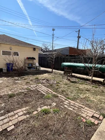 a view of a backyard with furniture