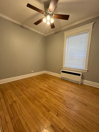 a view of room with wooden floor and window