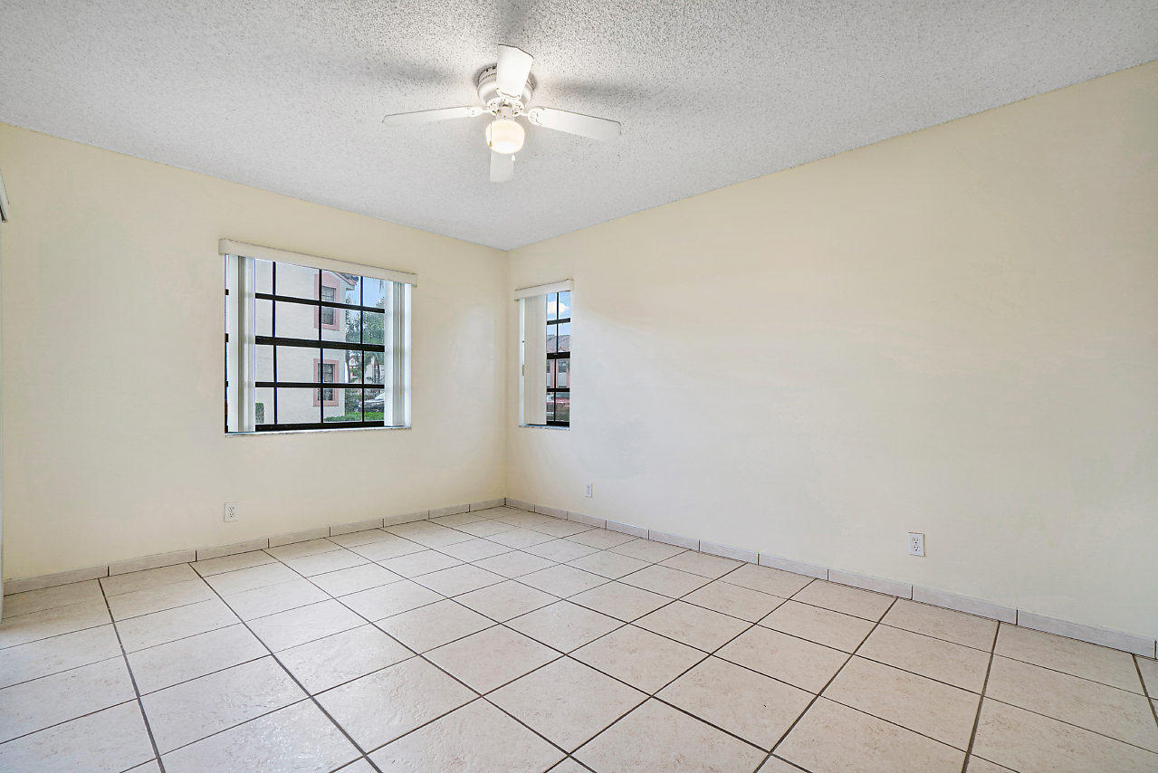 3050 Norwood Place, Unit N112 Boca Raton, FL 33431 - Photo 12 of 23 a view of an empty room with a window