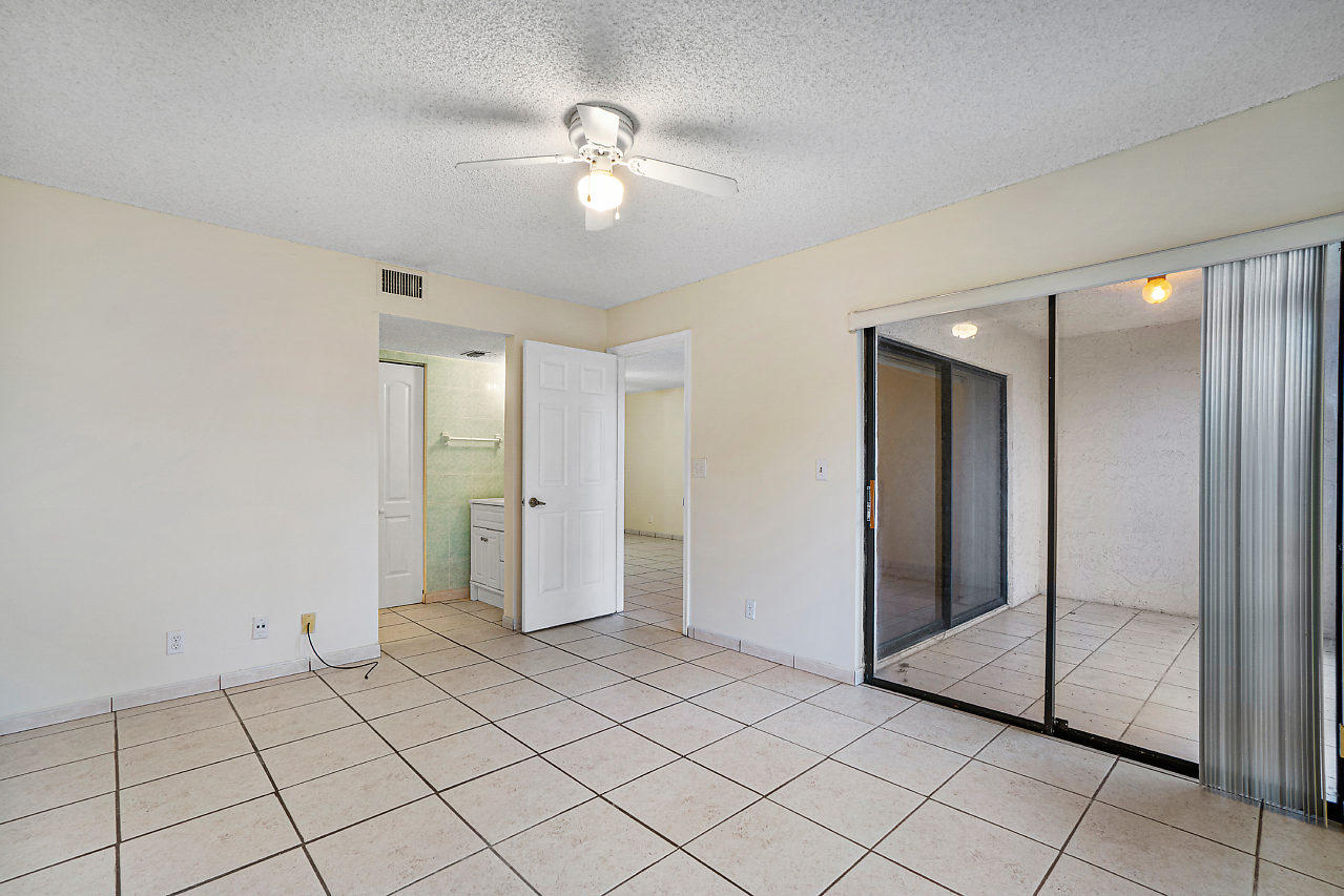 3050 Norwood Place, Unit N112 Boca Raton, FL 33431 - Photo 13 of 23 a view of an empty room and window