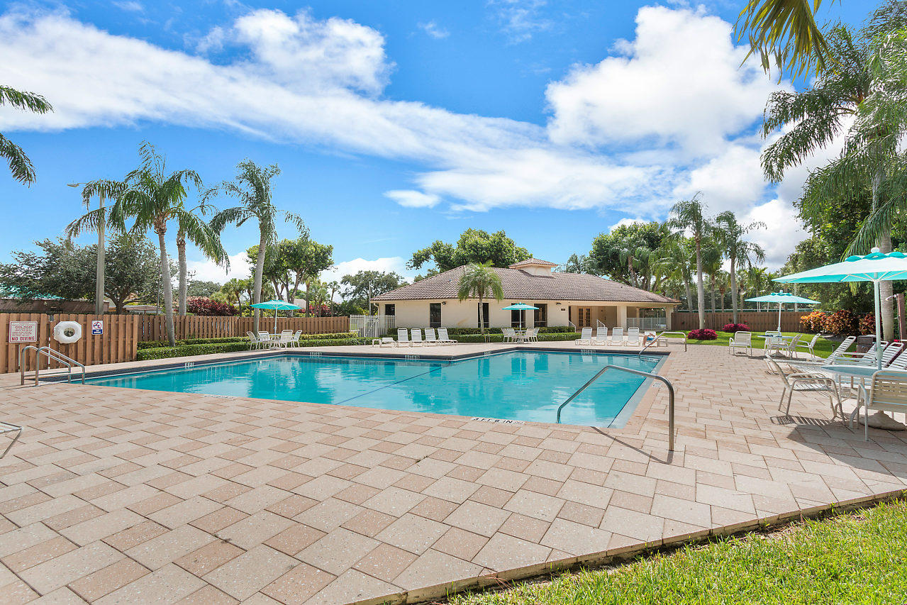 3050 Norwood Place, Unit N112 Boca Raton, FL 33431 - Photo 21 of 23 a view of a house with a yard