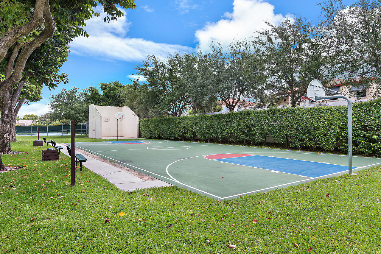 3050 Norwood Place, Unit N112 Boca Raton, FL 33431 - Photo 23 of 23 a view of a playground with basketball court
