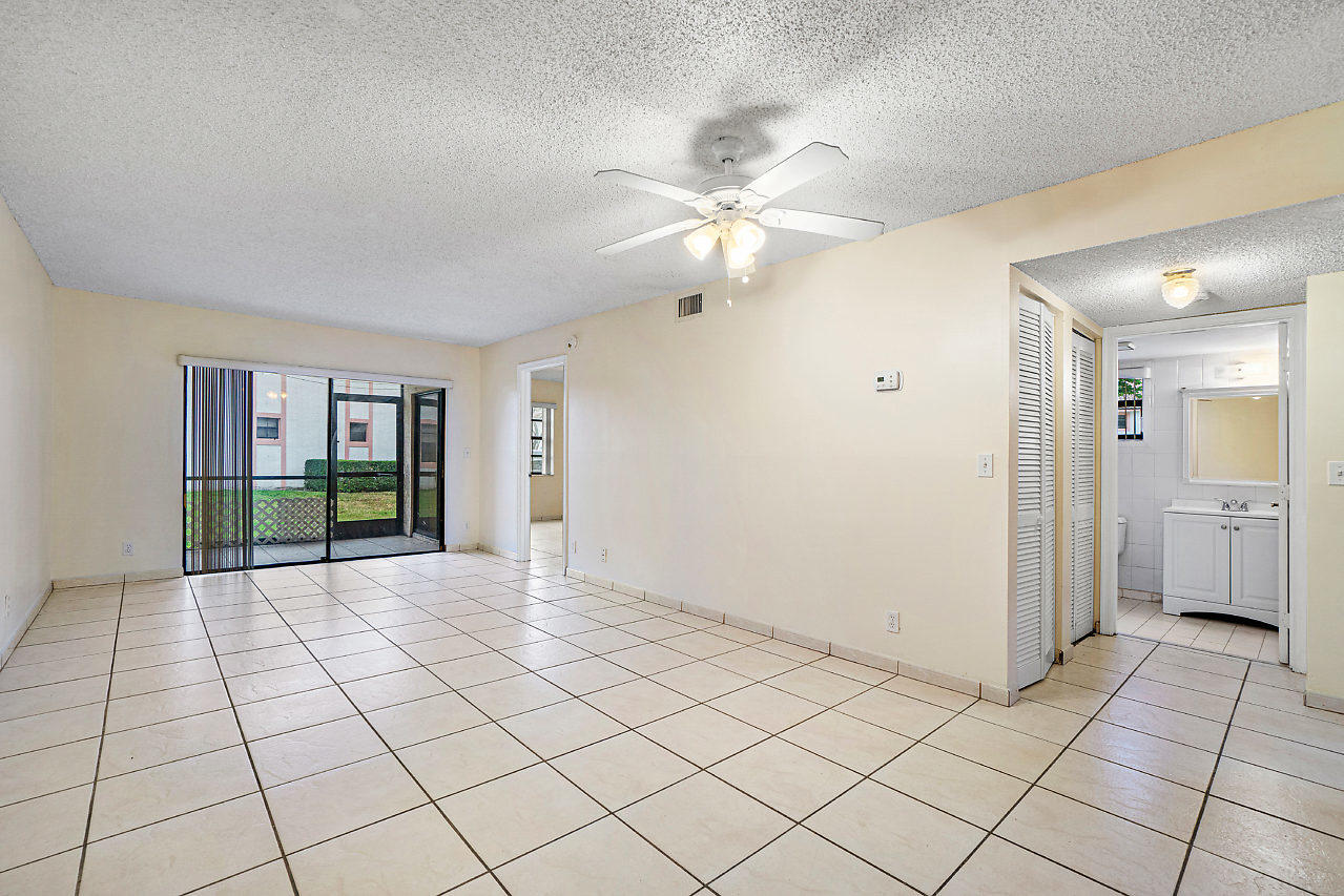 3050 Norwood Place, Unit N112 Boca Raton, FL 33431 - Photo 4 of 23 a view of an empty room and window