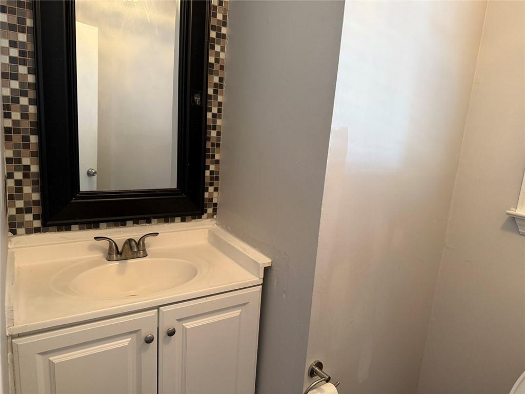 3383 Hamilton Mill Road Buford, GA 30519 - Photo 16 of 18 a bathroom with a sink and a mirror