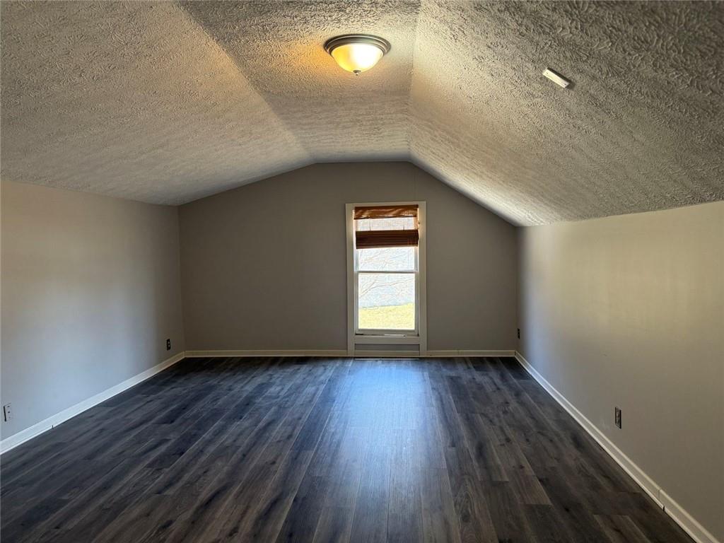 3383 Hamilton Mill Road Buford, GA 30519 - Photo 2 of 18 wooden floor in an empty room with a window