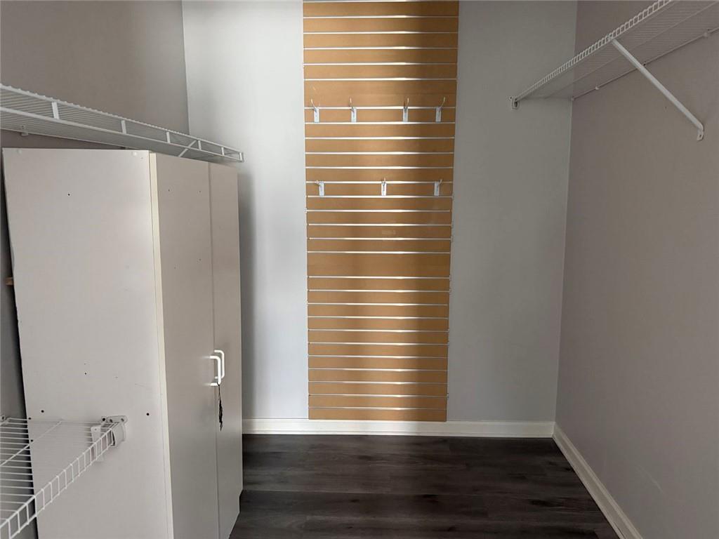 3383 Hamilton Mill Road Buford, GA 30519 - Photo 5 of 18 a view of empty room with wooden floor and fan