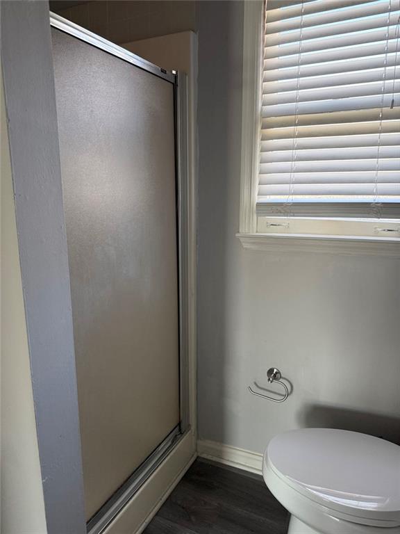3383 Hamilton Mill Road Buford, GA 30519 - Photo 6 of 18 a white toilet sitting next to a window