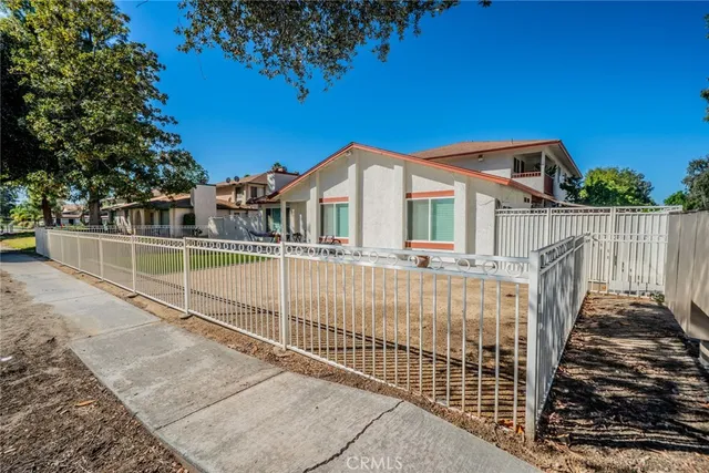a view of a wrought iron fences in front of house