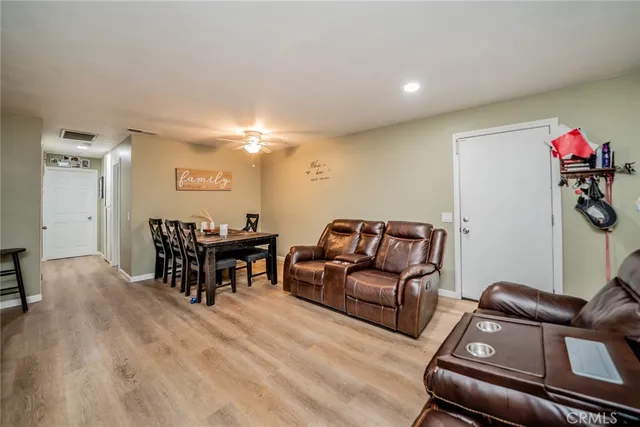 a view of an entryway with wooden floor